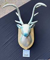 Front view of silver and blue deer head wall mount