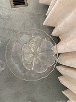 Top view of pedestal plate showing scalloped rim and central mount