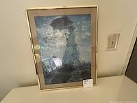 Full view of framed jigsaw puzzle art on table
