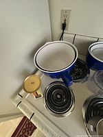 Overall view of bowls, pitchers, scale on stovetop