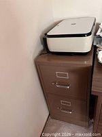 Full view of cabinet with scanner on top