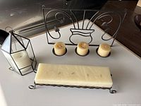 All three candleholders with candles displayed together