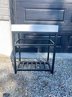 Front view of assembled vanity showing sink set on metal frame