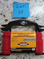 Packaged Fix It! braided polyester rope on plastic spool with label showing specifications