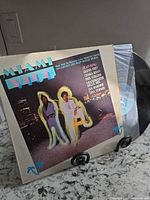 Front cover and vinyl partially shown in inner sleeve