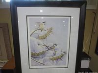 Full view of framed print under glass