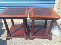 Front view of both tables showing tops, legs, and shelves
