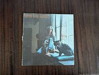 Front album cover showing Carole King seated by window with cat