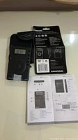 Front view of Grundig M400 radio in case with manual and packaging card
