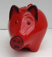 Front view of red ceramic piggy bank