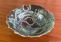 Top angled view showing full abstract glaze and scalloped rim