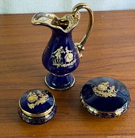 three cobalt blue Limoges pieces grouped on table