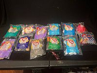 All twelve sealed Teenie Beanie Baby bags laid out to show numbering