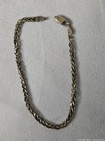 Full view of silver braided chain bracelet showing overall style