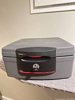 Closed SentrySafe showing logo, lock and exterior condition