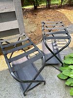 Both folding luggage racks outdoors