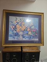 Front view showing floral print, matting and frame
