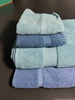 Stacked view of all four towels showing color and texture