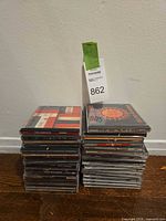 Two stacks of approximately 30 CD jewel cases