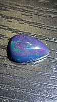 Front view of Ethiopian black opal showing play of color
