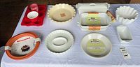 Overhead view of entire assortment of ceramic and silicone bakeware pieces on table