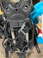 Front view of a Dräger PSS 5000 harness/backplate showing straps, fittings and branding