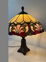 Lamp lit showing stained glass colours and metal base