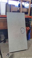 Top view showing grey laminate surface with paint marks