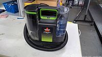 Front view of Bissell Little Green cleaner on table