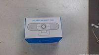 Closed blue and white retail box labeled HD Webcam eMeet C960