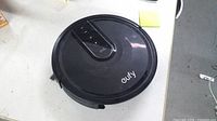 Top view of black Eufy robot vacuum
