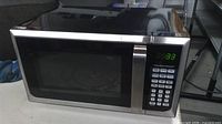Front view showing stainless trim, keypad and LED display