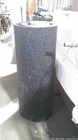 Full view of upright rubber mat roll
