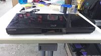 Front view of Samsung Blu-ray player on table