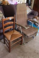 Photo showing whole lot including wood and wicker chair next to adjustable reclining chair with metal base.