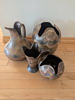 Group view of all four DB stoneware vessels