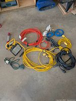 Grouped view of all cords, work light, and handheld light