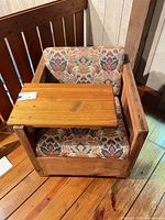 Front view showing attached side table, cushions, wood frame