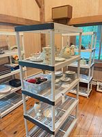 Front view of one plastic shelving unit with contents displayed