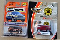 Both sealed Matchbox Volkswagen vans in packaging