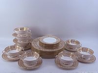 Stacked set showing soup bowls with saucers, dinner and side plates