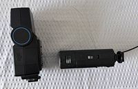 Side view of flash and battery pack showing connectors