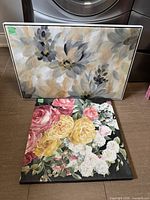 Both wall art pieces leaning together