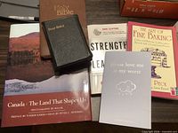 All six books arranged on tabletop showing covers