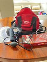 Overview of all items: Seneca bag, boxed stethoscope, sphygmomanometer, goniometer package