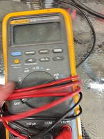 Front view of Fluke 87 III multimeter wrapped with leads