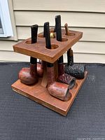 Front view of rack holding six pipes