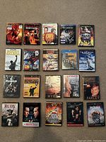 All 20 disc cases arranged in four rows of five on carpet