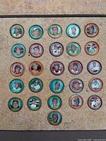 Full lot of 26 baseball metal coins laid out in grid