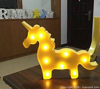 Unicorn light illuminated on tabletop
